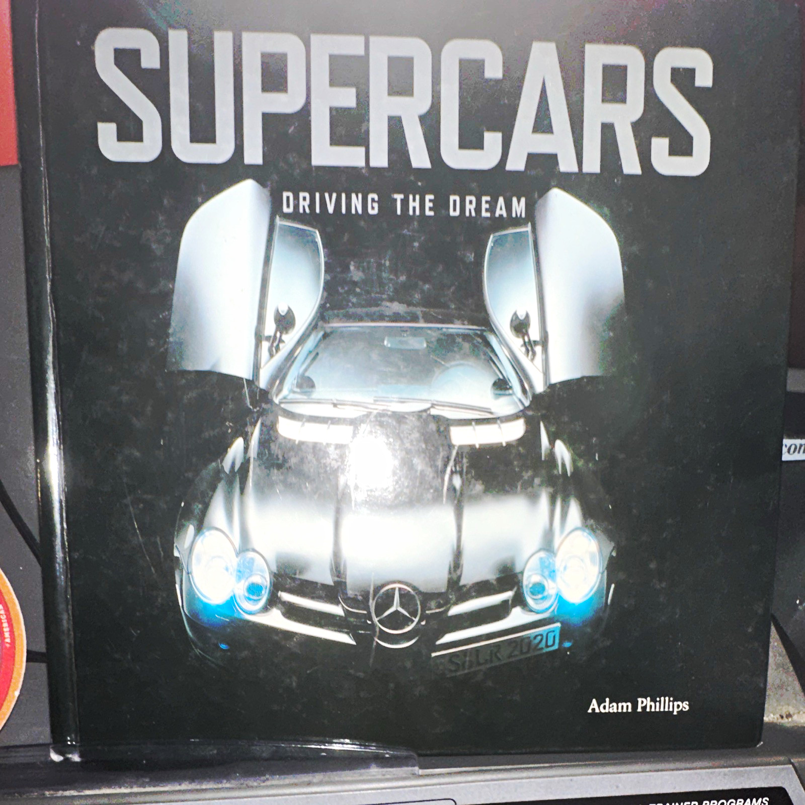Supercars: Driving the Dream by Adam Phillips Hardcover (2006) Supercars: Driving the Dream by Adam Phillips Hardcover (2006)