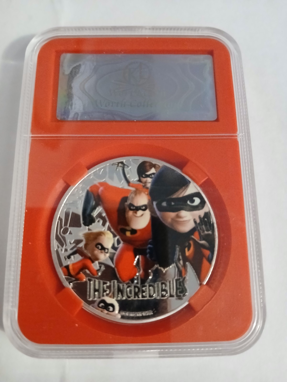 The Incredibles silver plated medallion in protective slab The Incredibles silver plated medallion in protective slab