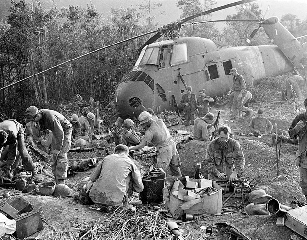 U.S. Marines emerge from their muddy foxholes 8\