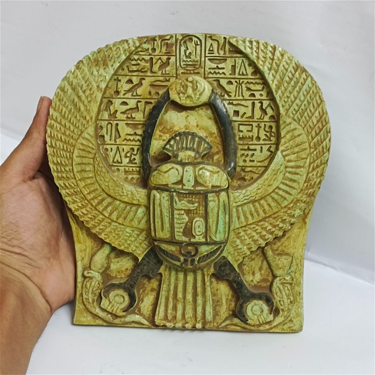 Vintage-style scarab relief symbolizing rebirth in ancient Egyptian culture