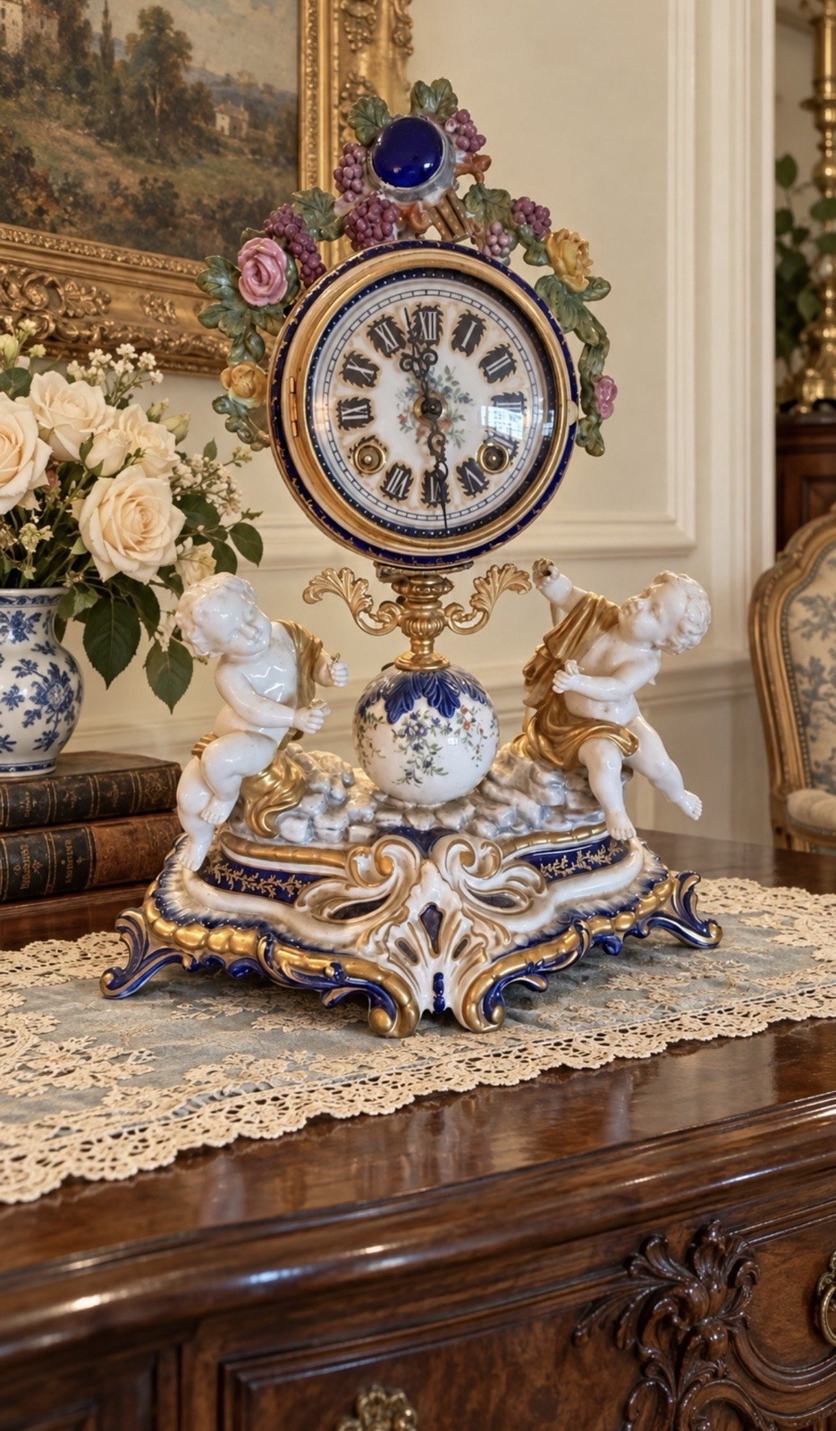 Sèvres-Style Porcelain Putti and Grape Clusters Mantel Clock. Sèvres-Style Porcelain Putti and Grape Clusters Mantel Clock.