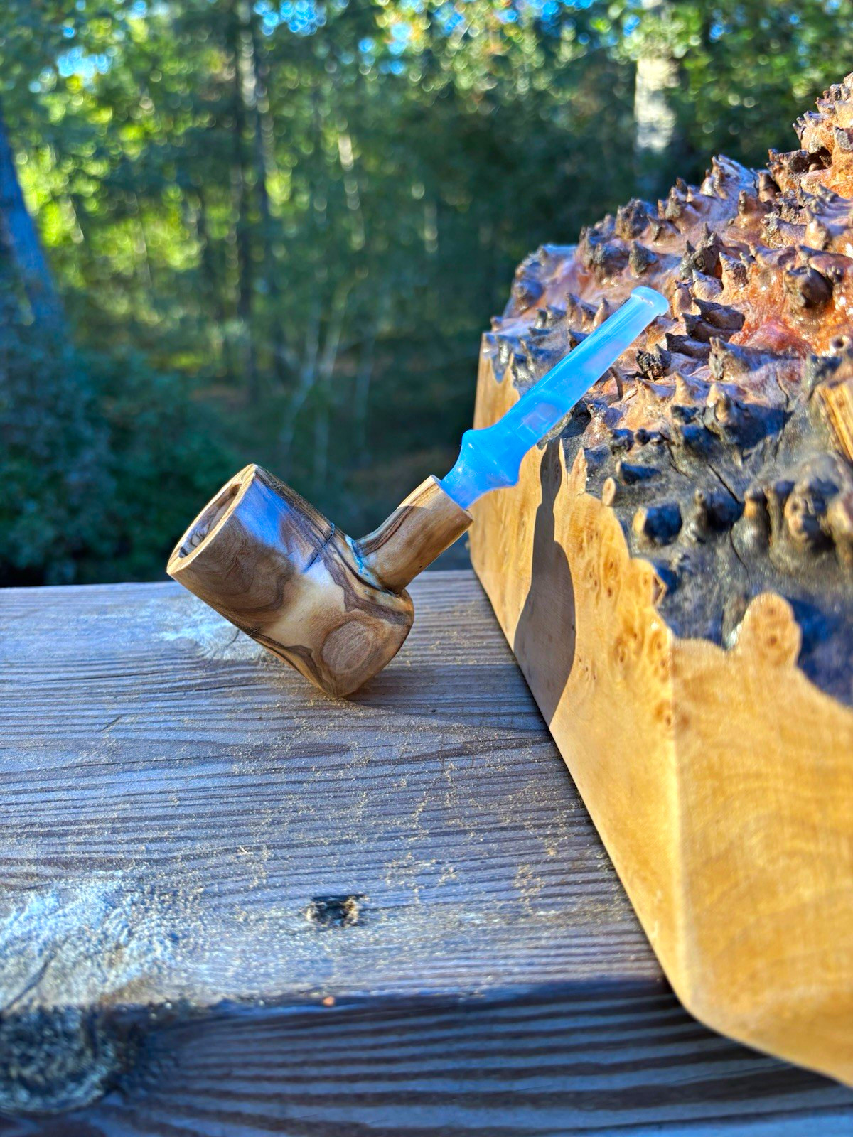 Olive wood Poker pipe with a lite blue ripple acrylic stem.