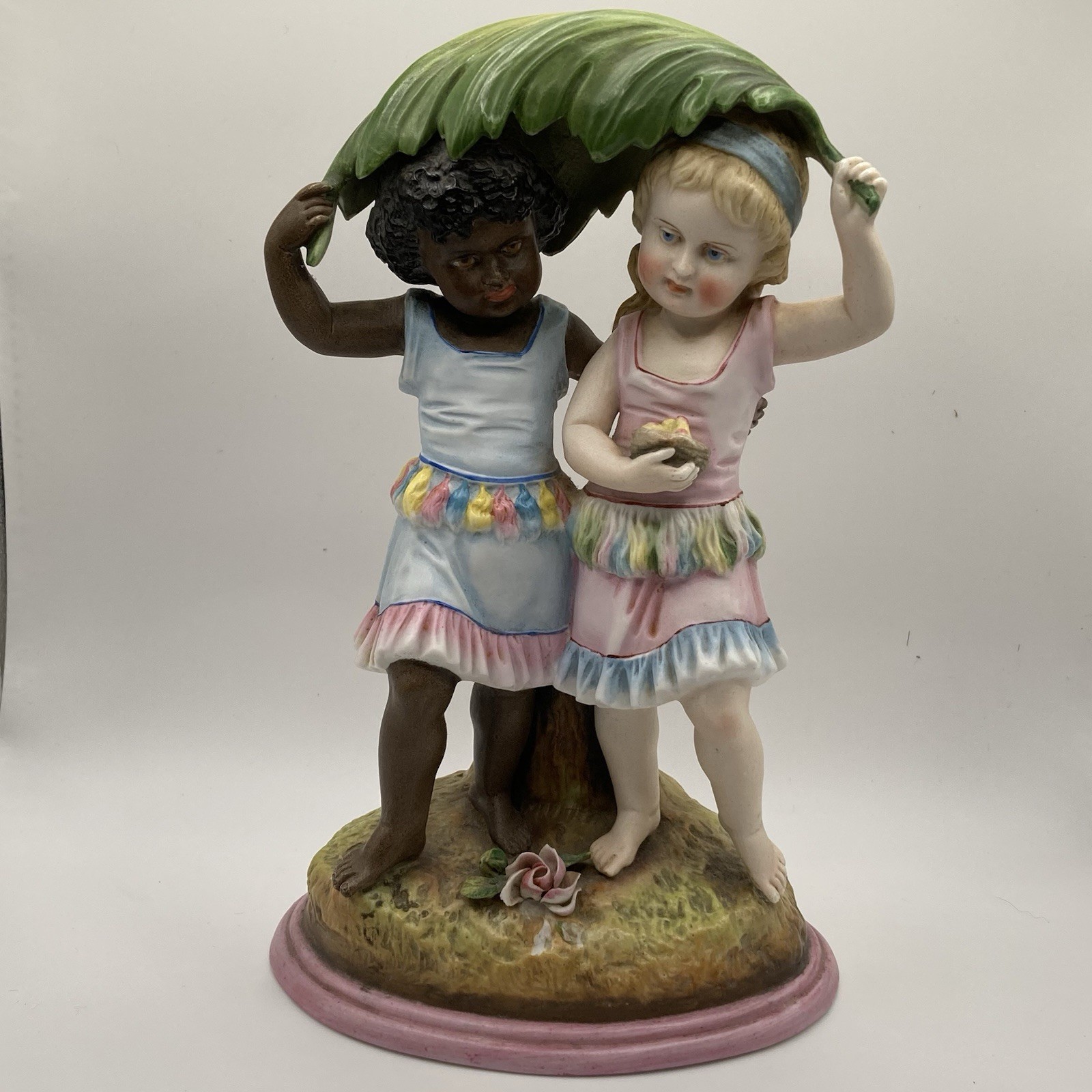 Antique Bisque African American & White Children Figurine Under Palm Frond Antique Bisque African American & White Children Figurine Under Palm Frond