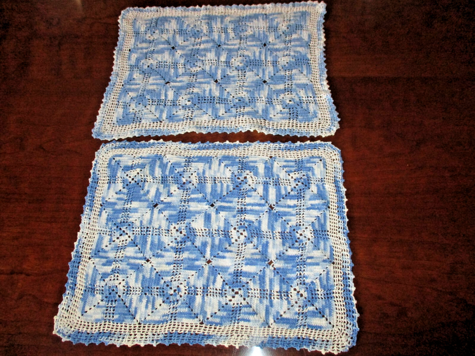 Pair of vintage varigated white/blue hand crocheted rectangular doilis