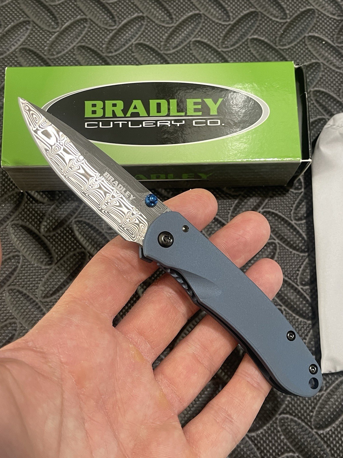 Bradley Cutlery Knives - Alias II - Blue Titanium Scales w/ a Damascus Blade. Bradley Cutlery Knives - Alias II - Blue Titanium Scales w/ a Damascus Blade.