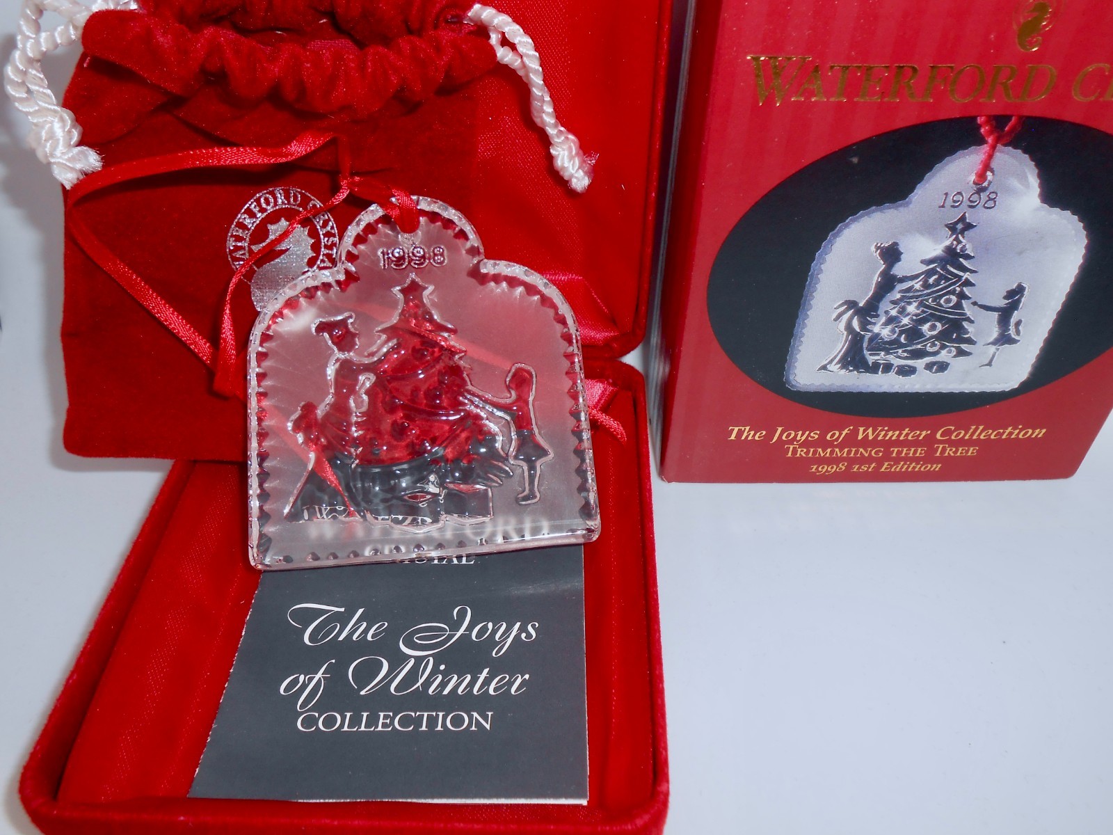 1998 Waterford TRIMMING THE TREE Crystal Ornament 1st Edition Joys of Winter H71