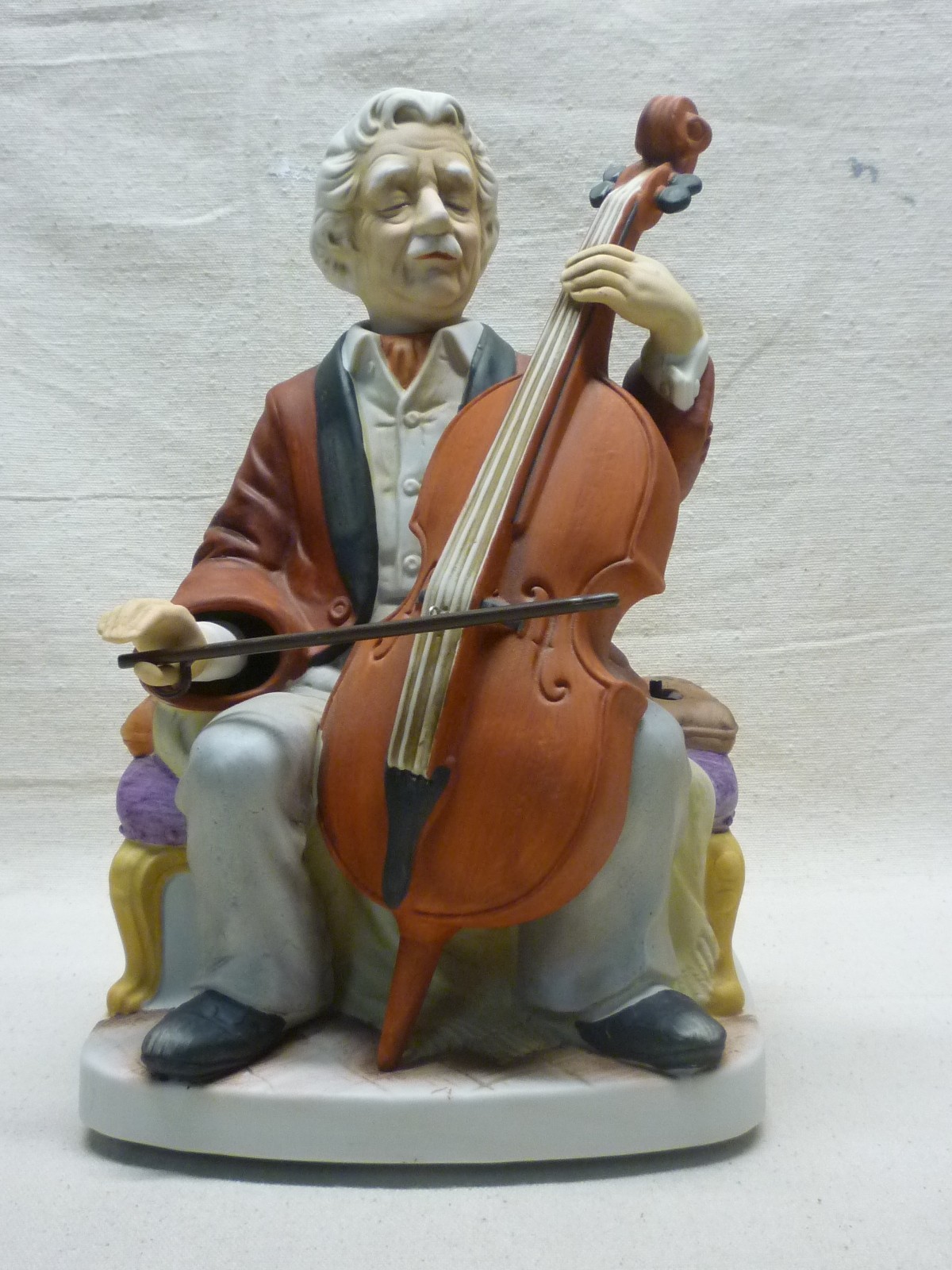 WACO MELODY IN MOTION THE CELLIST PORCELAIN MUSIC BOX FIGURINE