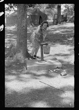 Photo:1930s Woman Pumping Water Camp Tent Rural Scene picture