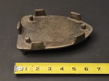 Antique cast iron sad iron trivet 6.5 inches, markings on bottom, guide pegs picture
