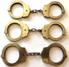 3 PAIR OF VINTAGE PEERLESS CHAINED HANDCUFFS picture