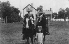 RPPC, FAMILY PICTURE  Men & Boys On Horses~Little Girl~House  1907-1929 Postcard picture