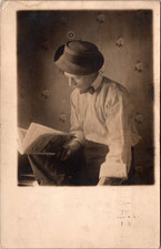 Postcard Real Photo RPPC Man with Hat and Bowtie Reading Popular Mechanics Pa picture