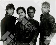 1983 Four men posing in leather jackets picture