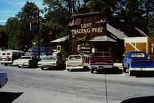 c1970's 35mm Slide Last Trading Post Chevrolet Ford Pickups USA Building Roof picture