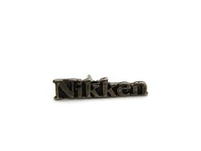 Vintage Nikken Lapel Pin Tie Tack Logo Wordmark Silver Tone Metal Promotional picture