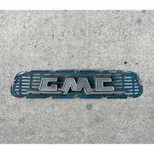 vintage 1955-1956 GMC Truck hood emblem with its original grille insert panel picture