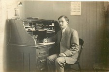 RPPC Postcard Young Business Man Looks Important At Secretary Desk April 1910 picture