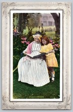 Vintage 1911 Embossed Postcard Showing Grandma & Child Reading picture