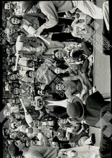 1983 Crowd of people are gathered around a man performing a juggling act picture