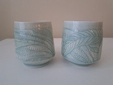 Vintage. Two matching Elaine Coleman carved cups with celedon glaze. picture