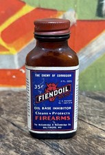 VINTAGE C. 1930 FIENDOIL 2 OZ PAPER LABEL BOTTLE NOS SIGN DEVIL GUN FIREARMS TIN picture