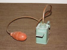VINTAGE PRIMITIVE SQUEEZE RUBBER METAL BOX POWDER DUSTER picture
