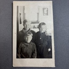 RPPC Three young boys brothers with varying haircuts incl bowl cut. unp picture