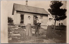 Vintage 1910s Real Photo RPPC Postcard Family Posing in Front of Small House picture