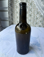 Antique Dark Green Glass Utility Bottle with Applied Seal Medallion Inner Temple picture