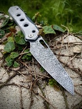 CUSTOM WE “War Torn” Vision R— Holographic Etch 20CV, Hand Textured Titanium picture