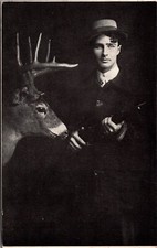 Photo Postcard Raymond Calkins Hunter With Rifle & Mounted Stag’s Head 1909 picture