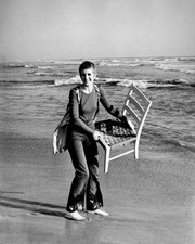 British singer Julie Driscoll raising a chair by the seashore 1960s Old Photo picture