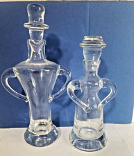 NEIMAN MARCUS PAIR OF CLEAR GLASS MAN & WOMEN OIL HOLDERS picture