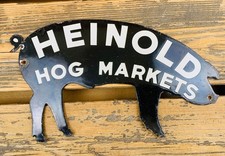 VINTAGE 12X7” HEINOLD HOG MARKETS BLACK PIG FARM GAS OIL METAL PORCELAIN SIGN picture