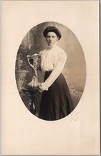 c1910s MEDFORD, Wisconsin Studio Photo RPPC Postcard Woman Posing with Vase picture