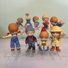 Lot of 9 Vintage Enesco Figurines, Tumbling, Skiing and Other activities.  picture