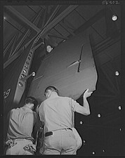 Photo:1930s-1940s Aircraft Hangar Mechanics Moving Large Plane Panel picture