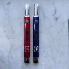 Vintage Git-Er-Done Candle Set Of Two Lighters picture