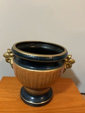 vintage earthenware vase or planter, specifically in a blue and oc picture
