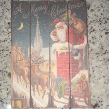 Rustic wooden wall hanging features a classic vintage Christmas picture