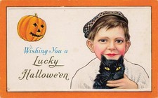 STECHER c1910 EMBOSSED HALLOWEEN POSTCARD 80C YOUNG BOY HOLDS BLACK CAT picture