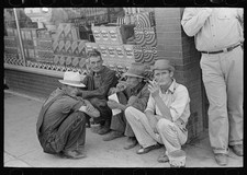 Caruthersville Missouri 1938 Farmers Squatting on Sidewalk Storefront picture