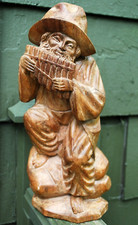 Antique BLACK FOREST GERMANY Hand Carved Wood Sculpture MAN PLAYING PAN PIPES picture