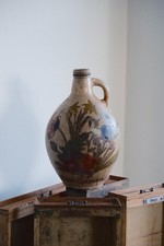 Mid 17th century large salt-glazed stoneware bottle with unusual floral motif picture
