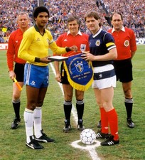 Brazil captain Geraldao exchanges pennants with opposite number Ro- Old Photo picture
