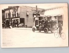 c1910 Fire Truck Driving Street Scene Boy Bicycle Dowagiac Michigan MI RPPC Post picture