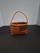 Handmade woven reed basket featuring a tan, red,  Blue with single arched handle picture