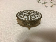 Mid-century, vintage embossed footed metal trinket box with red lining. picture