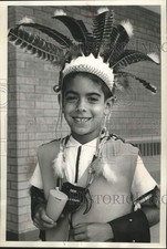 1964 Press Photo An Indian Hill school student wears Native American headgear picture