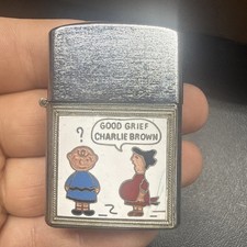1960'S ADULT THEMED CHARLIE BROWN AND LUCY CIGARETTE LIGHTER SUPER WINDKING picture